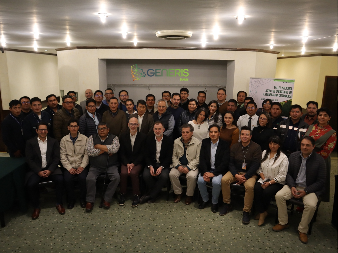 A photo of the participants of the workshop, standing in front of a GENERIS banner. There are three rows of people, about 40 people in total.